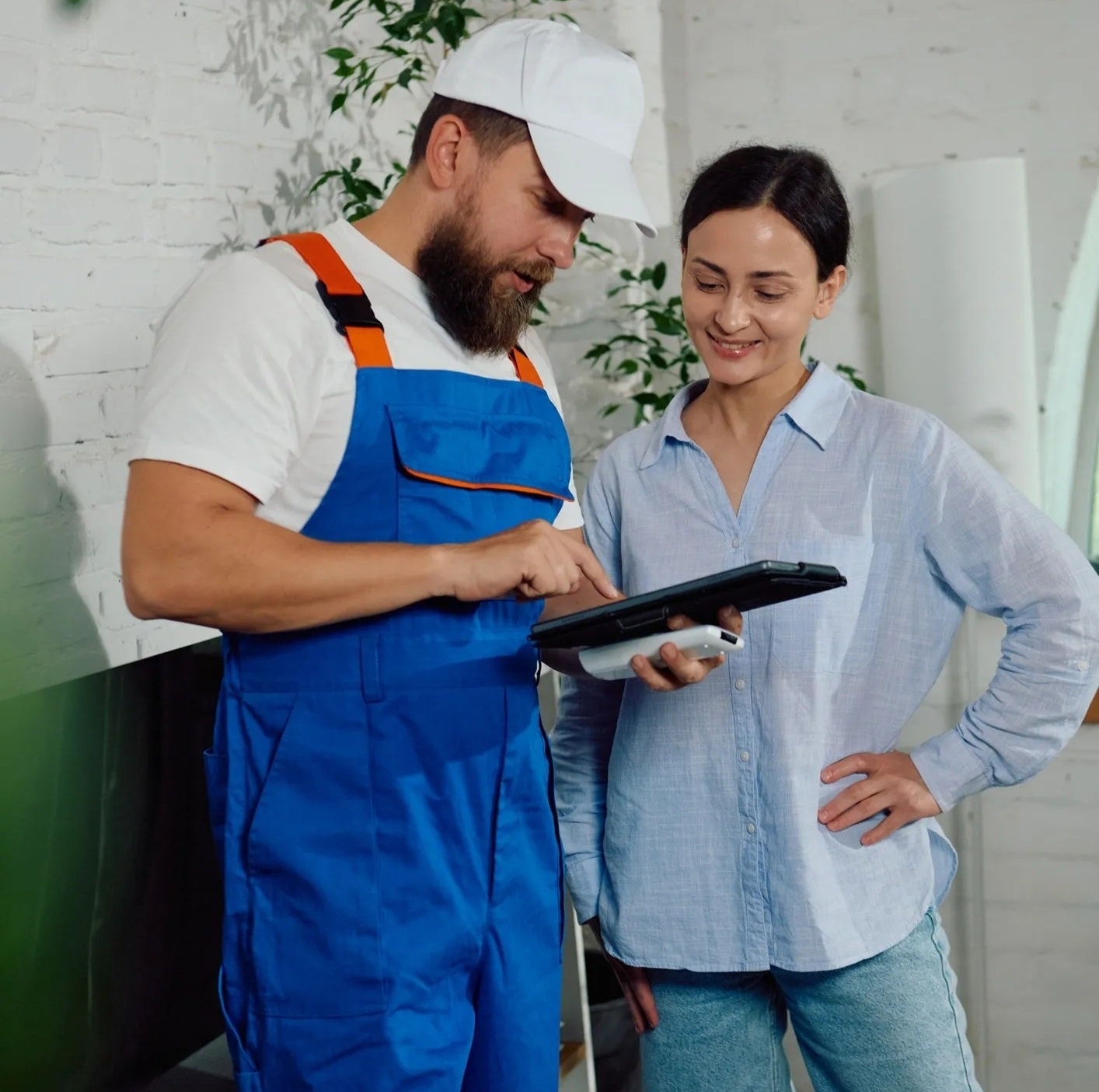 HVAC technician explaining residential service options to a homeowner